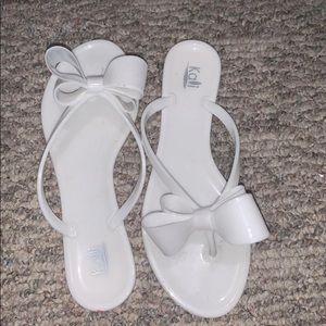 white bow flip flops